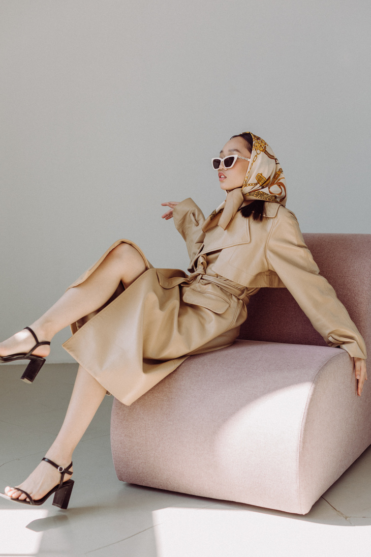 Stylish Woman in Coat, Scarf and Sunglasses